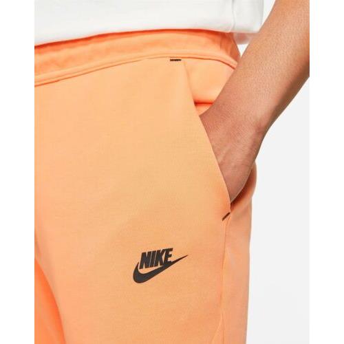 nike tech orange joggers