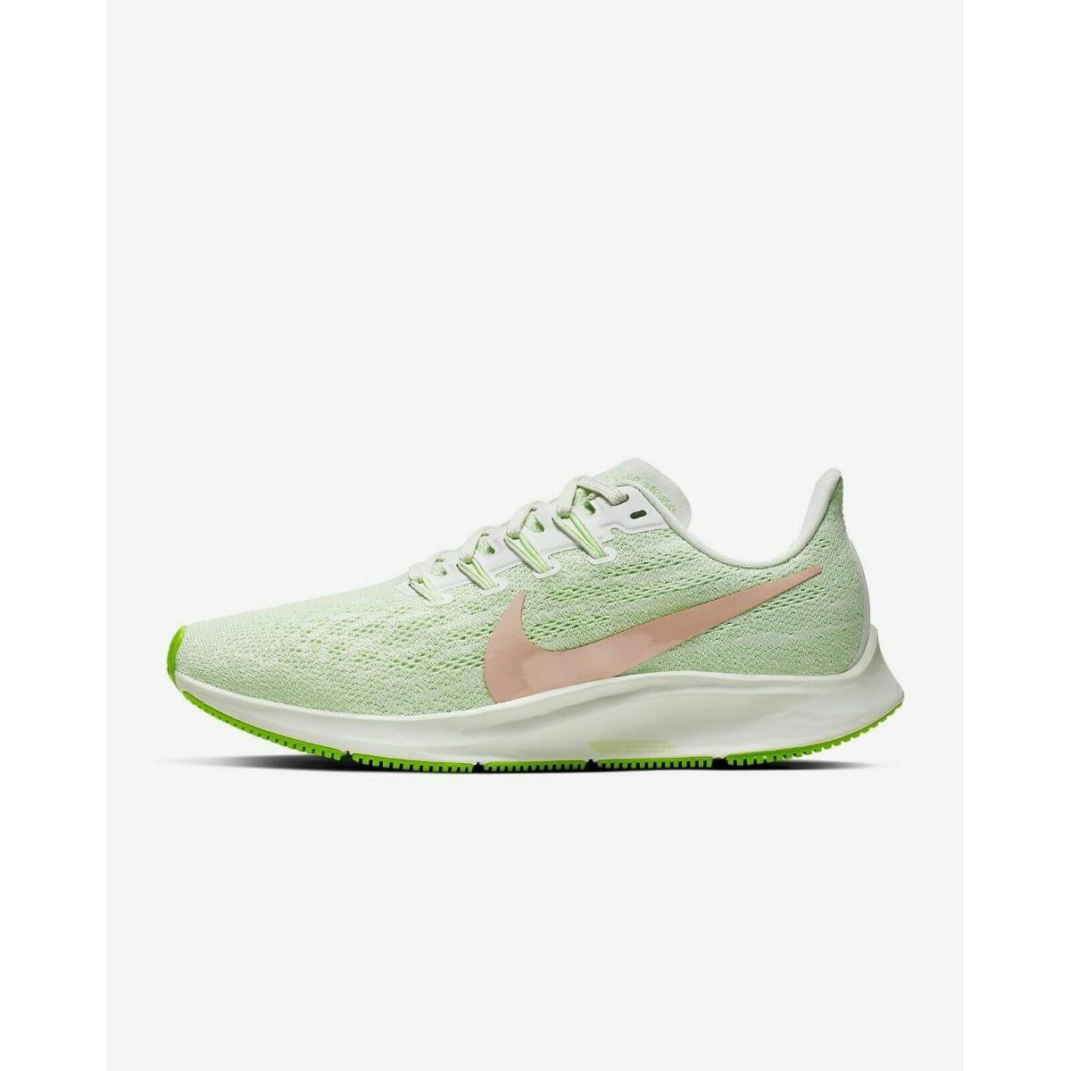 green and white nike running shoes