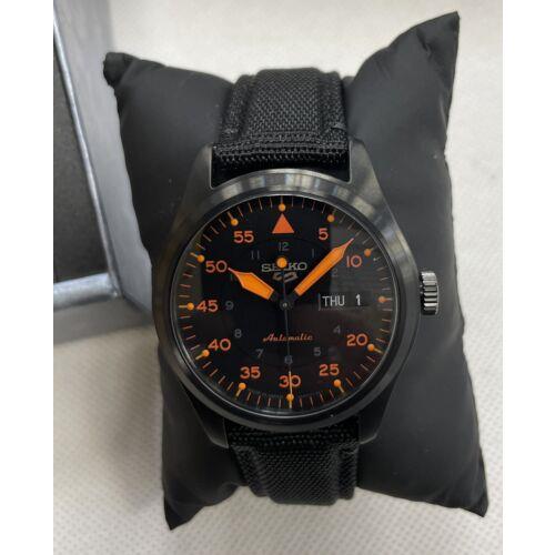 Seiko watch  - Dial: Black Dial And Orange Hands And Numbers, Band: Black In Front , Orange At The Back