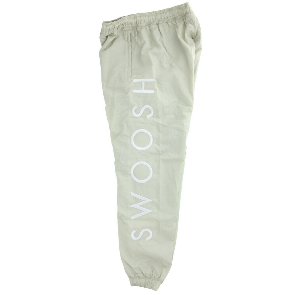 Nike Men`s Sportswear Pants CU3890 Nylon Embroidered Swoosh Lettering Pockets