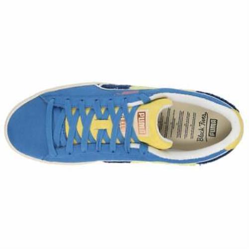 blue and yellow puma trainers