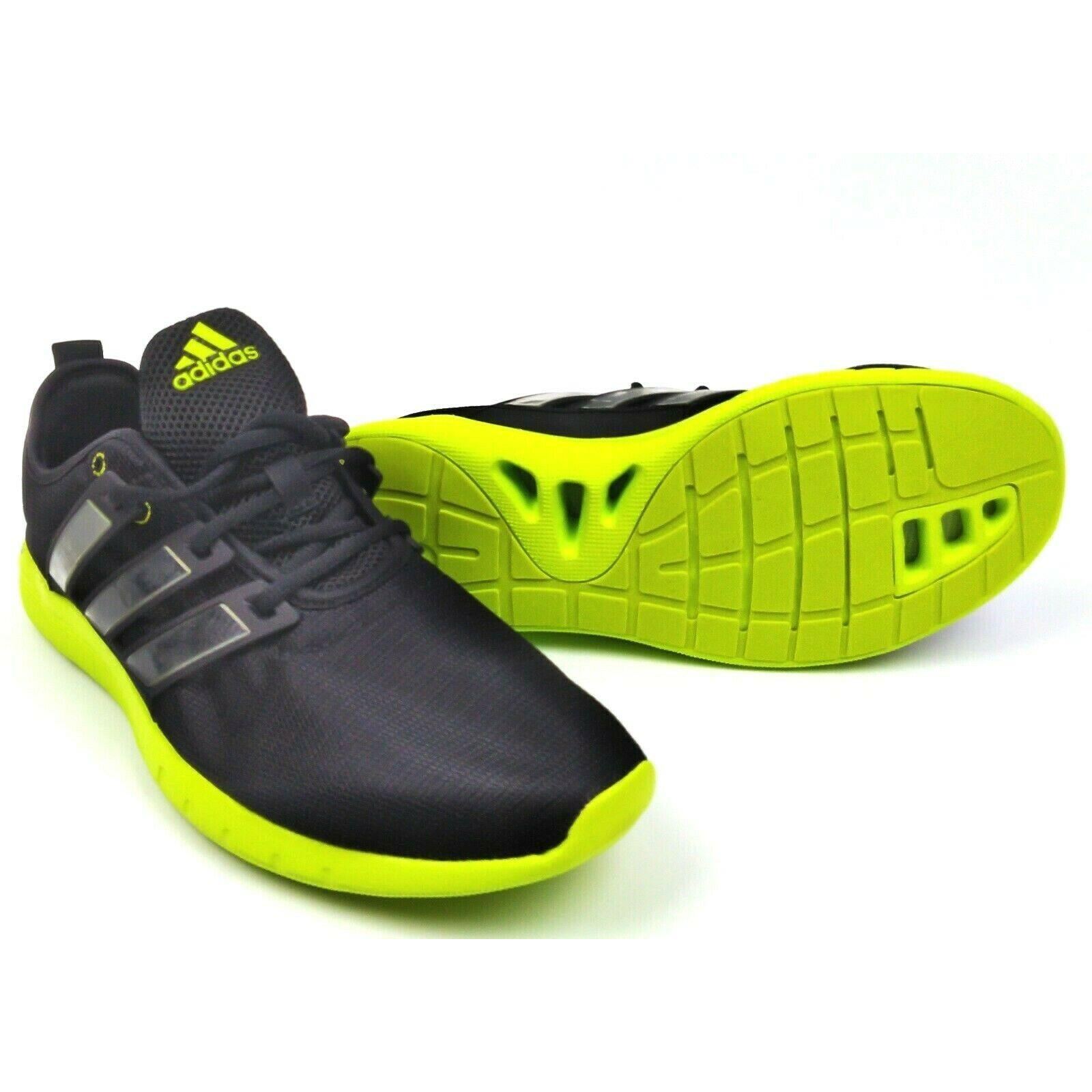 black and lime green running shoes