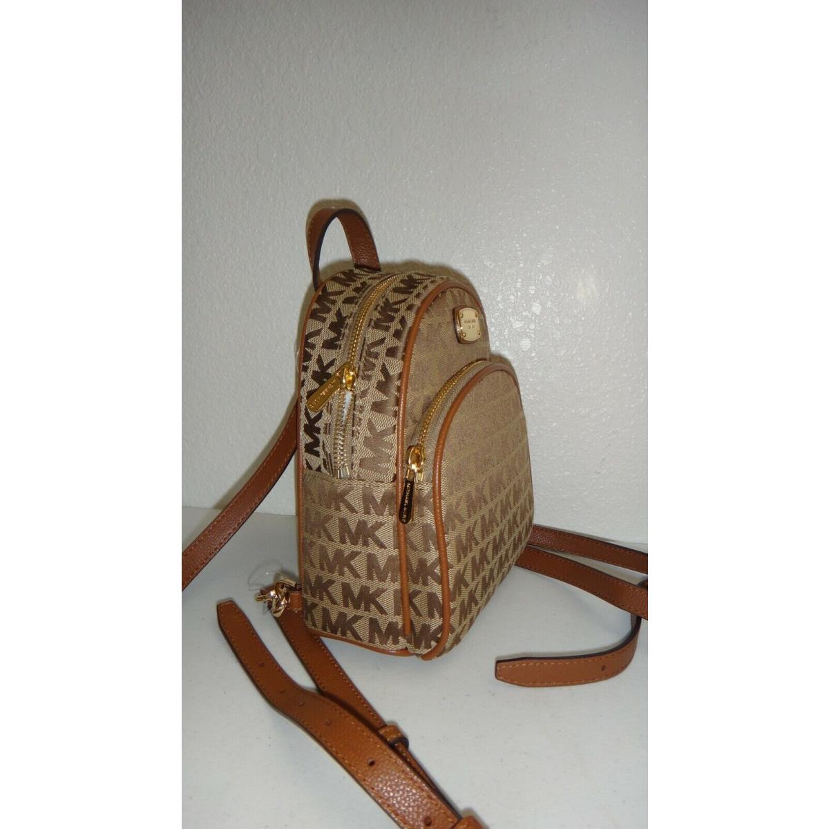 Michael Kors Abbey XS MK Signature Jacquard Zip Backpack Bag Beige Ebony  Luggage | 007334110375 - Michael Kors bag Abbey - Beige Lining, Beige /  Ebony / Luggage / Gold Exterior | Fash Direct