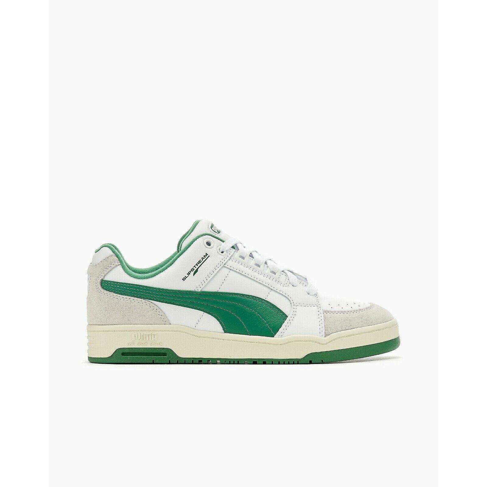 green and white puma trainers