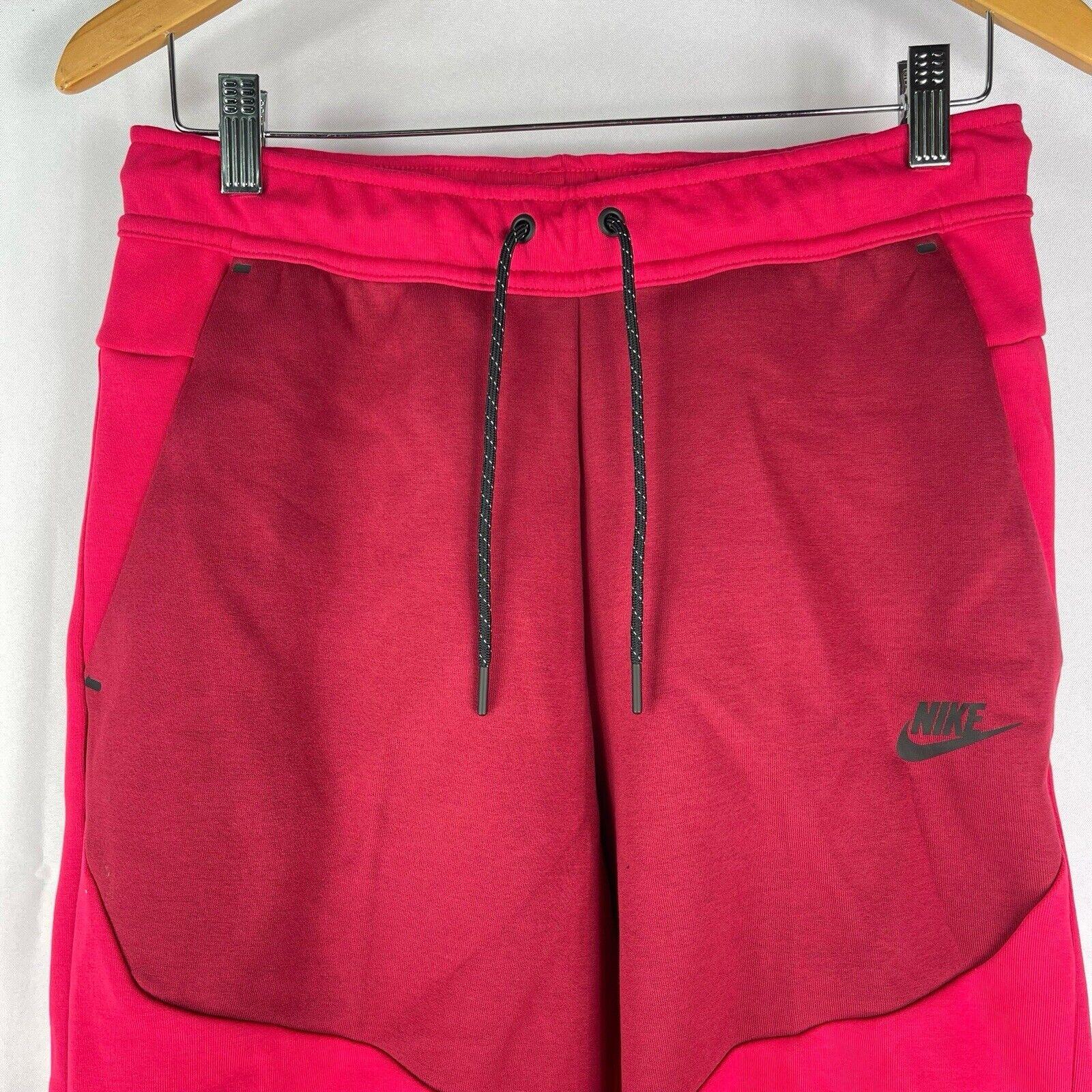 pink nike tech fleece shorts