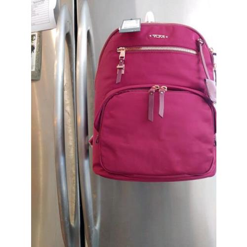 pink tumi bag