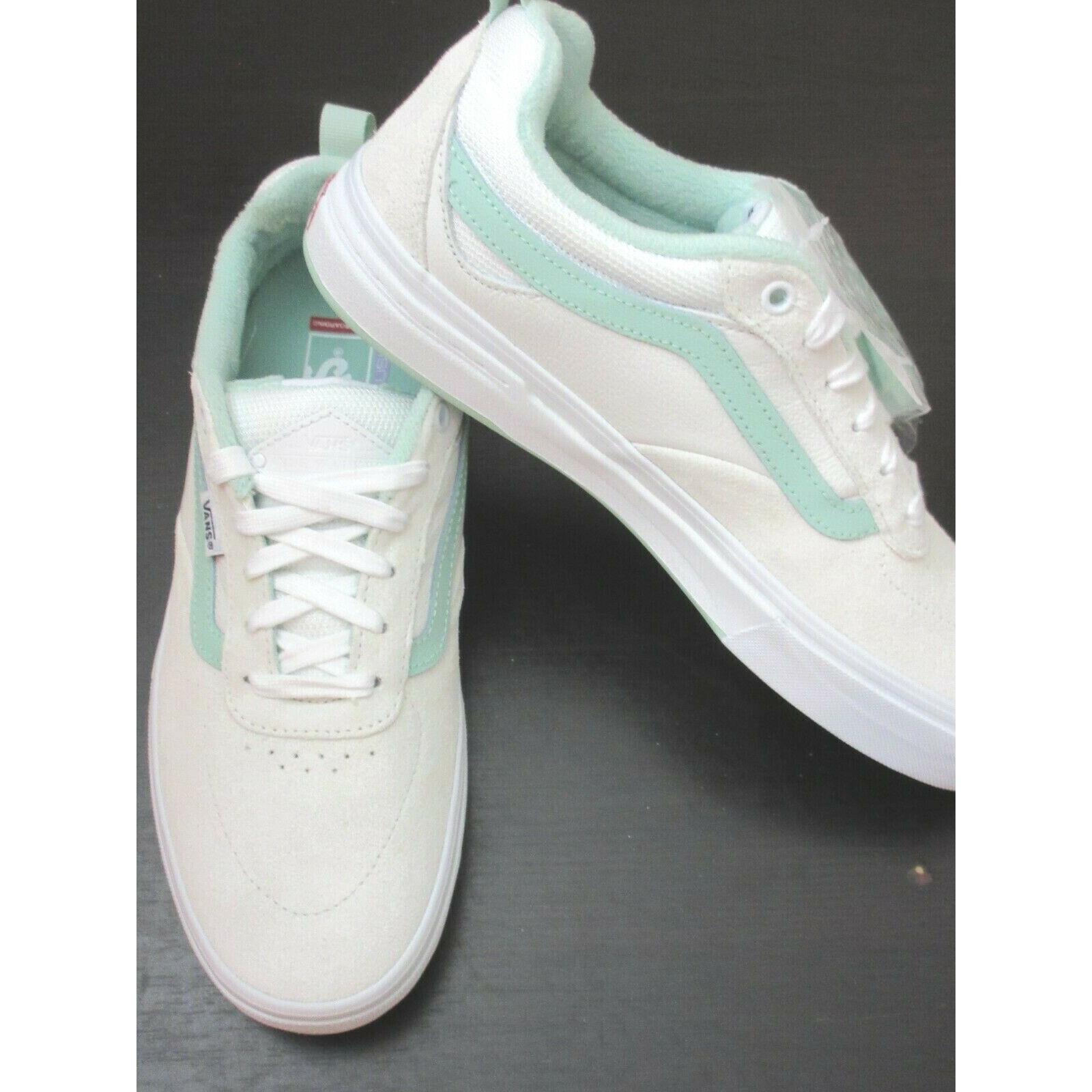 mint green and white vans