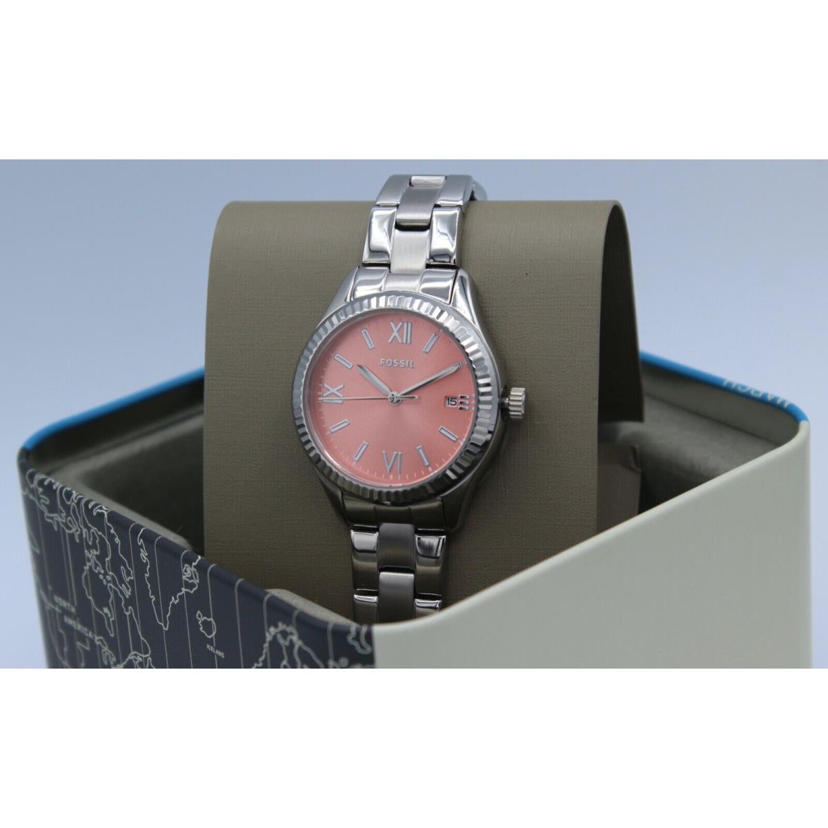 Silver fossil watch shop with pink face