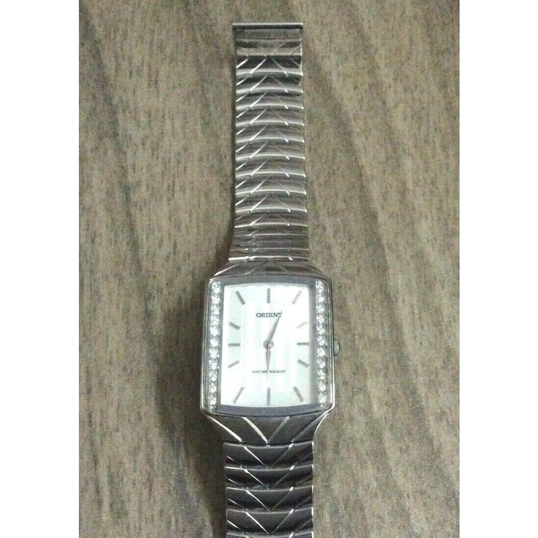 Orient Men`s Watch Crystal Rectangle Silver Dial Silver on Linked Band Style