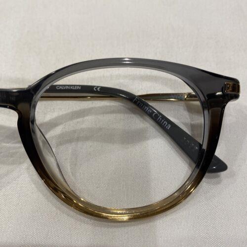 Calvin Klein eyeglasses  - Frame: Crystal Grey/brown Gradient 10