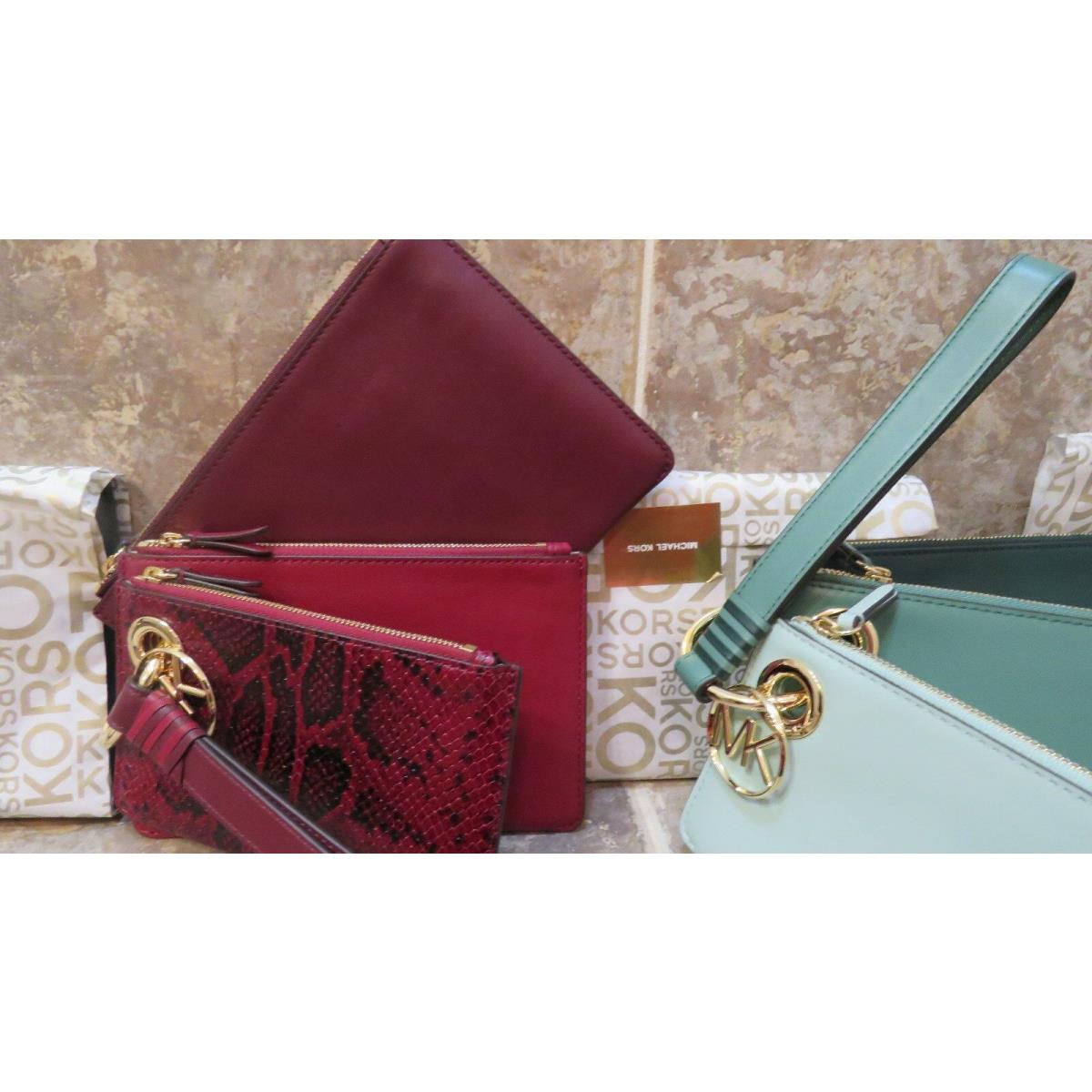 Michael Kors Wristlet/clutch Set: 3 Sizes + Charm + Ring + Strap Interchangeable burgandy and oxbloodmaroon