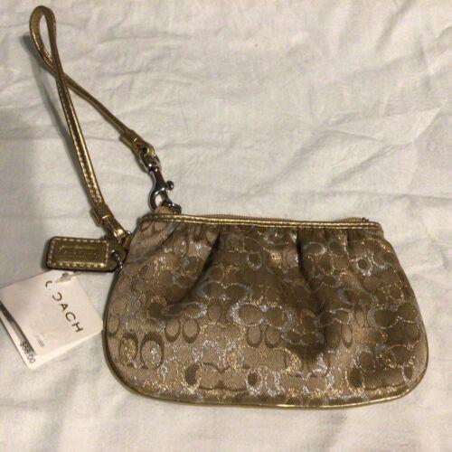 Coach Clutch or Make-up Handbag silver/gold.6 1/4 Wide by 4 in.tall.42036