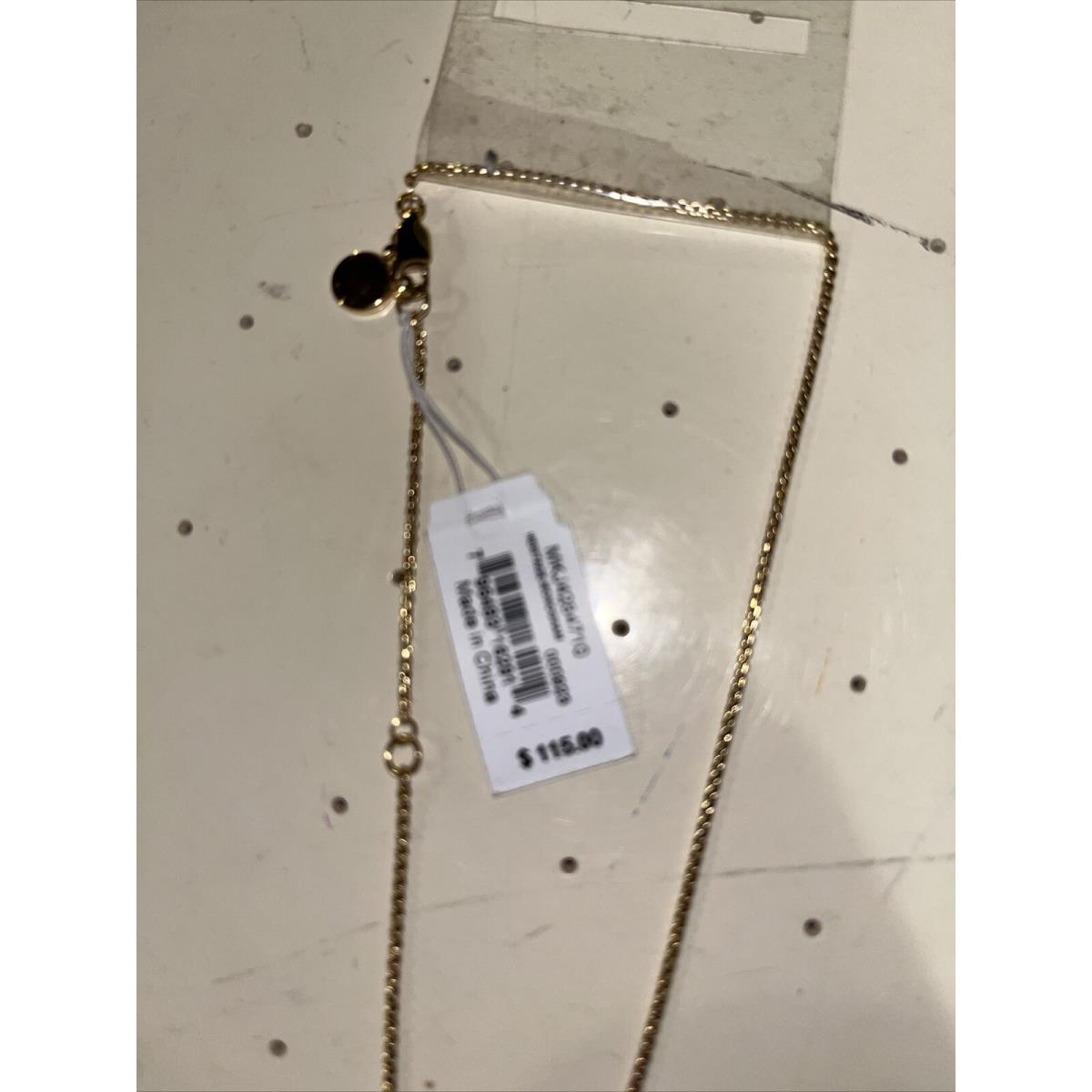 Michael Kors Heritage Monogram Gold-tone Logo Crystal Disc Necklace and More