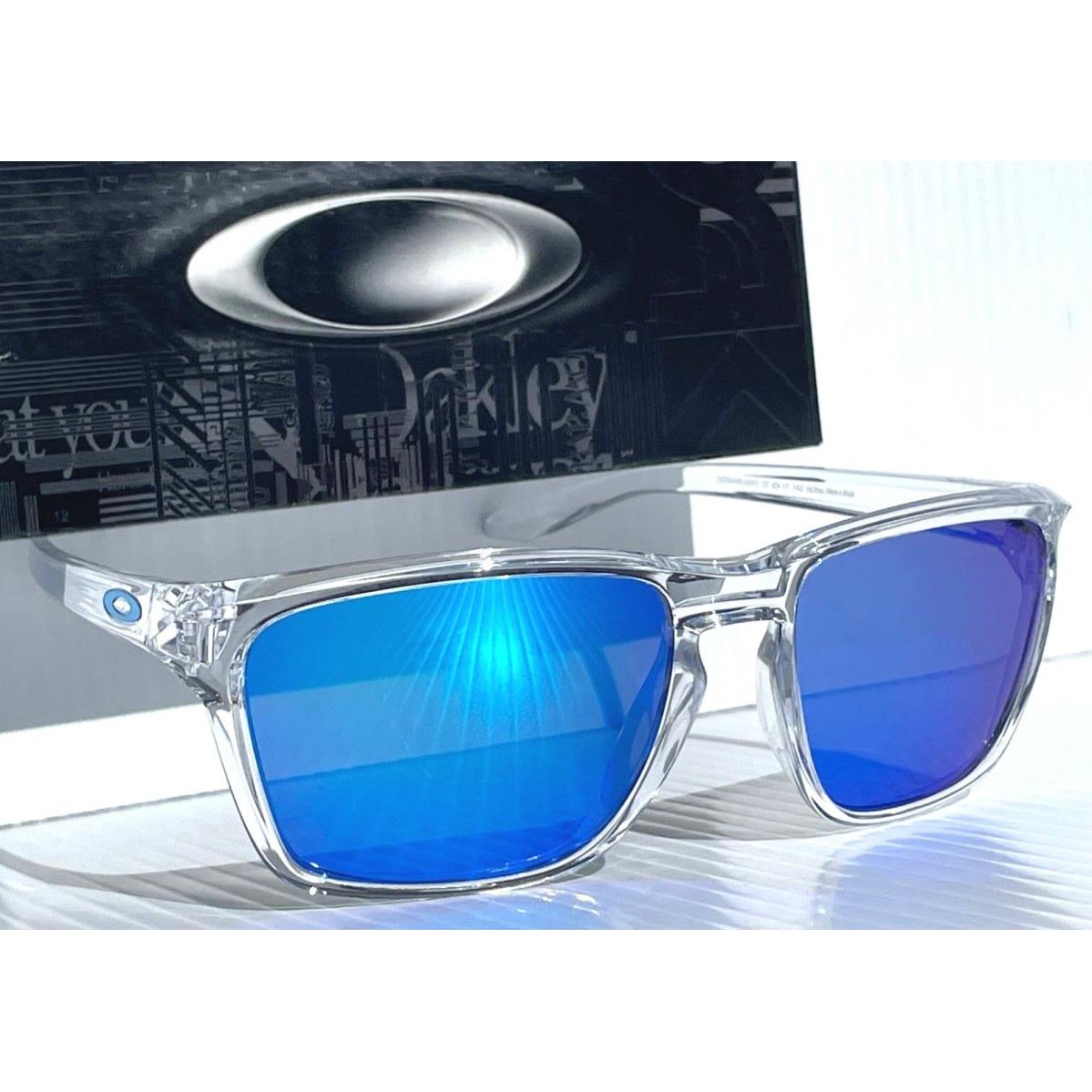 Oakley Sylas Polished Clear Crystal Polarized Galaxy Blue Lens Sunglass 9448