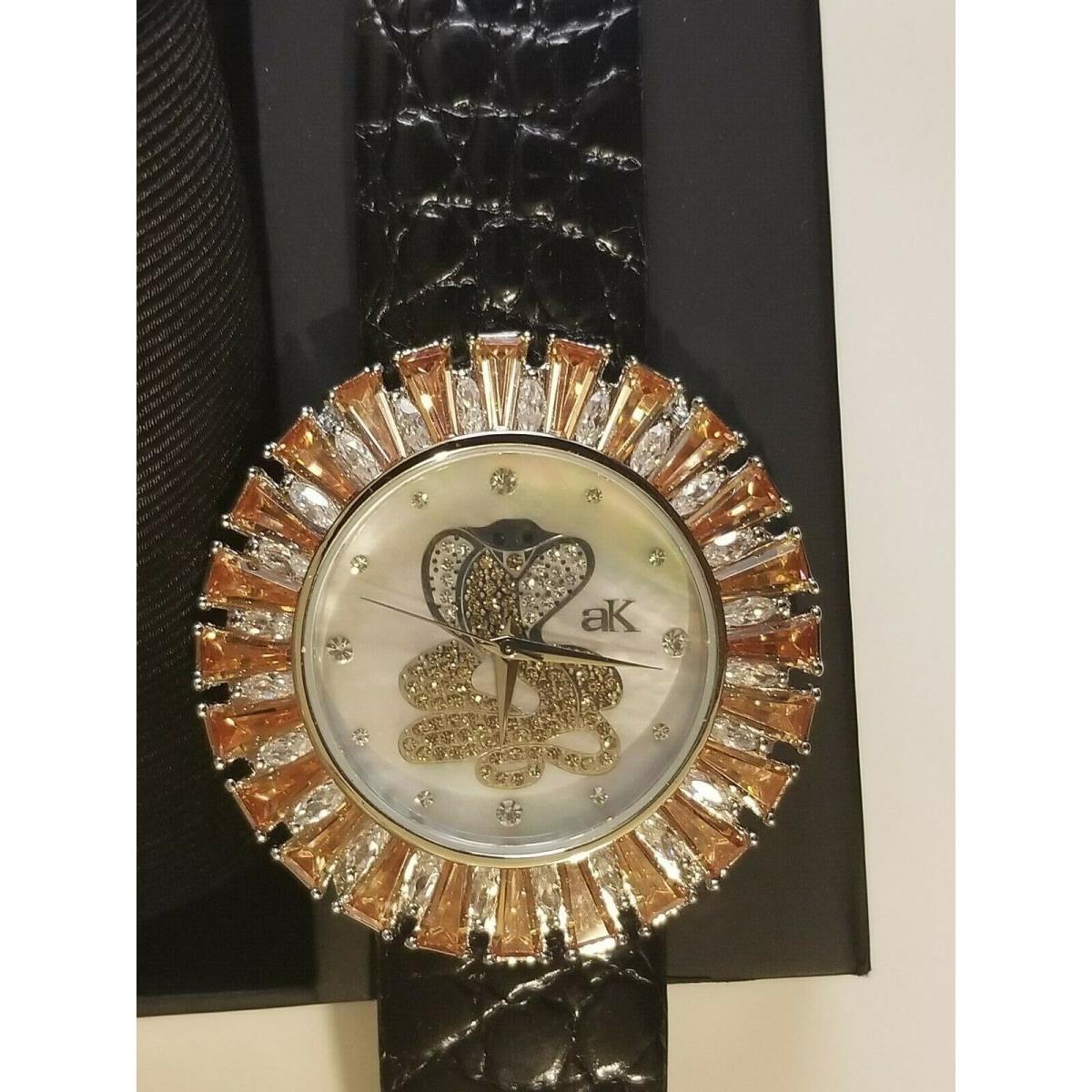 Cobra in Mother of Pearl Dial Watch by Adee Kaye with Yellow Austrian Crystals