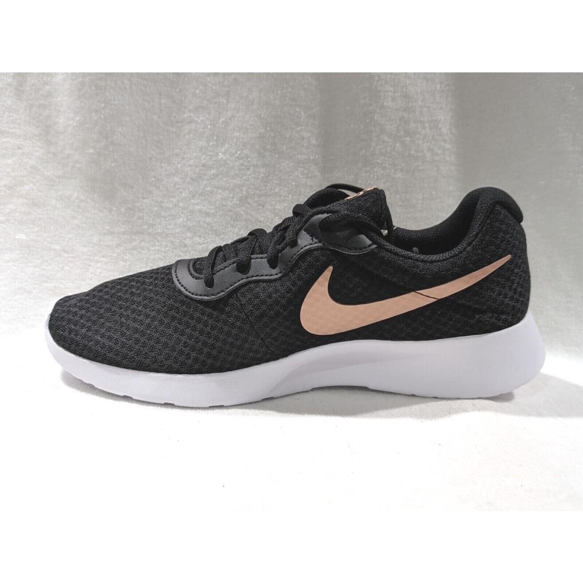 Nike tanjun black red bronze best sale