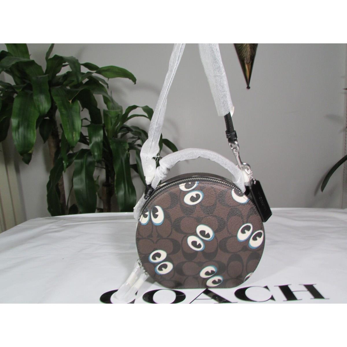 Coach Signature Canvas Halloween Eyes Canteen Crossbody CM766 Brown Black Mu