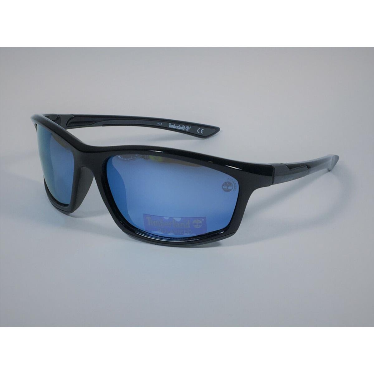 Timberland Men`s TB7149 6201D Polarized Wrap Sunglasses Black Blue Mirror Lens