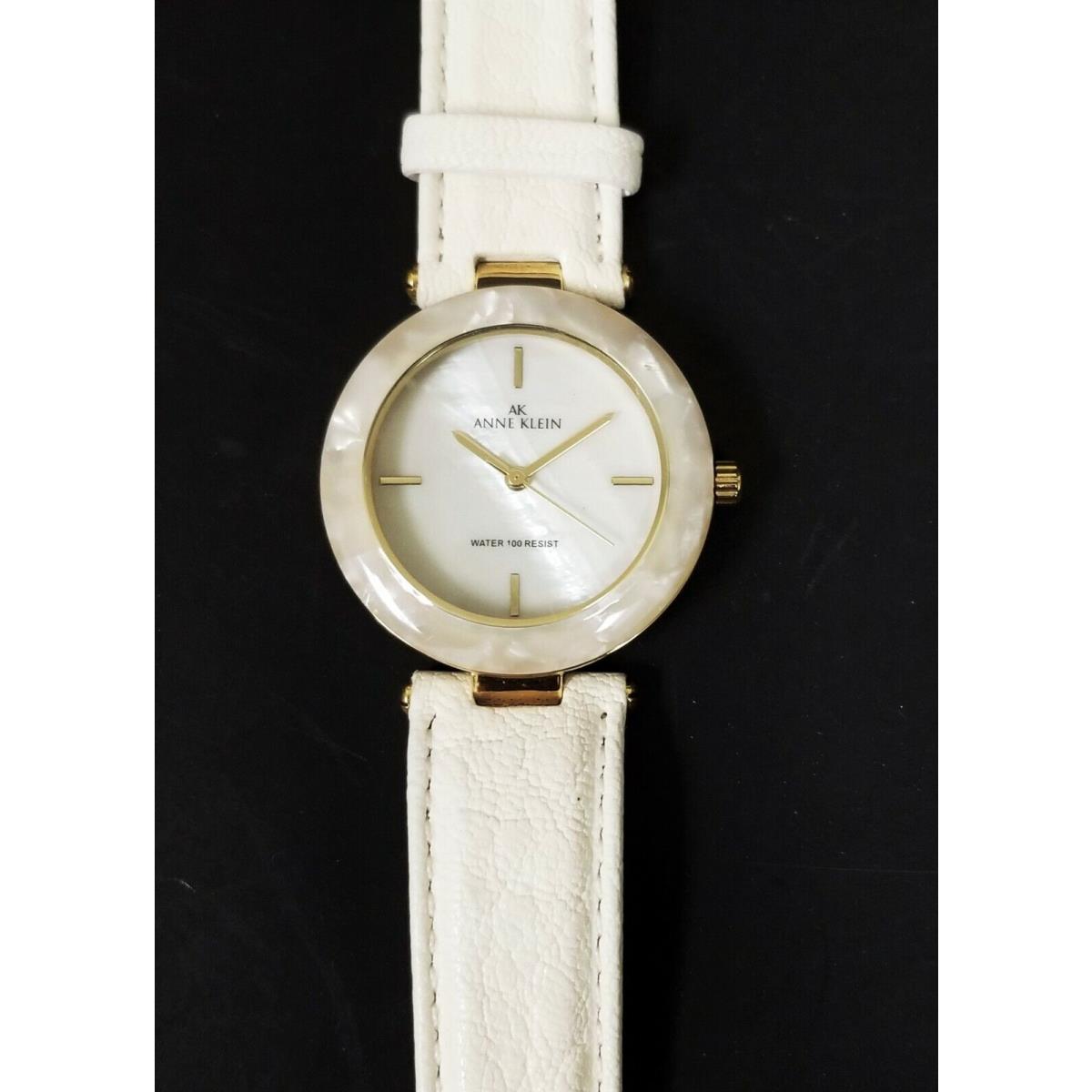 Anne Klein Gold Tone Bone Cream Leather Band Tan Acrylic Bezel Mop Watch 10/9852