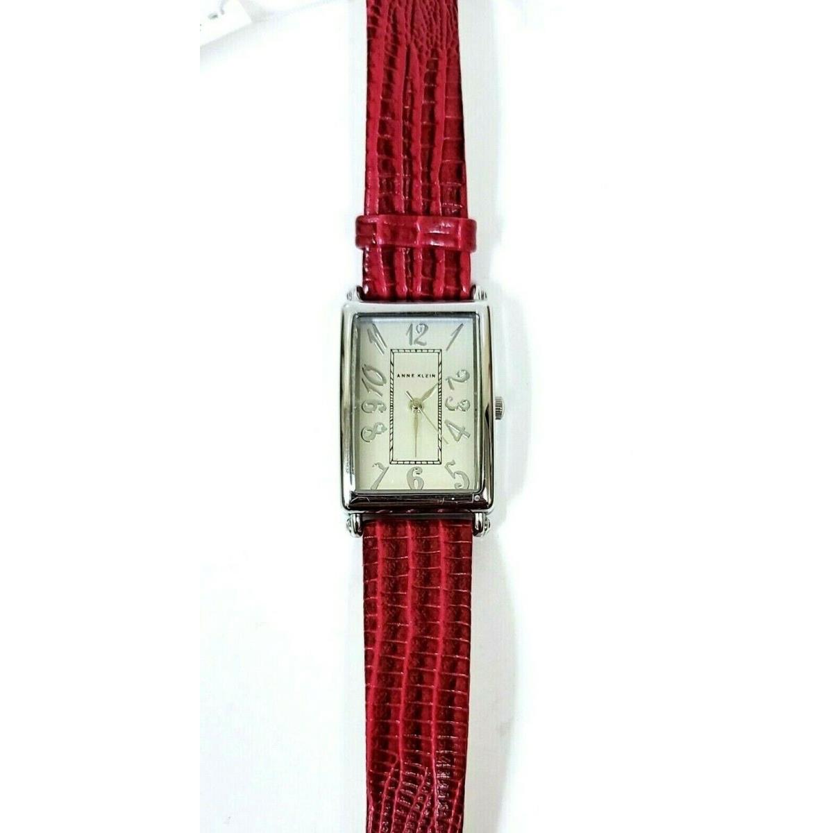 Anne Klein Silver Tone Fuchsia Embossed Leather Backing Band Watch AK/2175