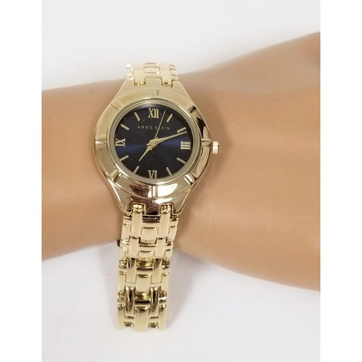 Anne Klein Gold Tone Black Dial Roman `S Bracelet Watch AK/2020