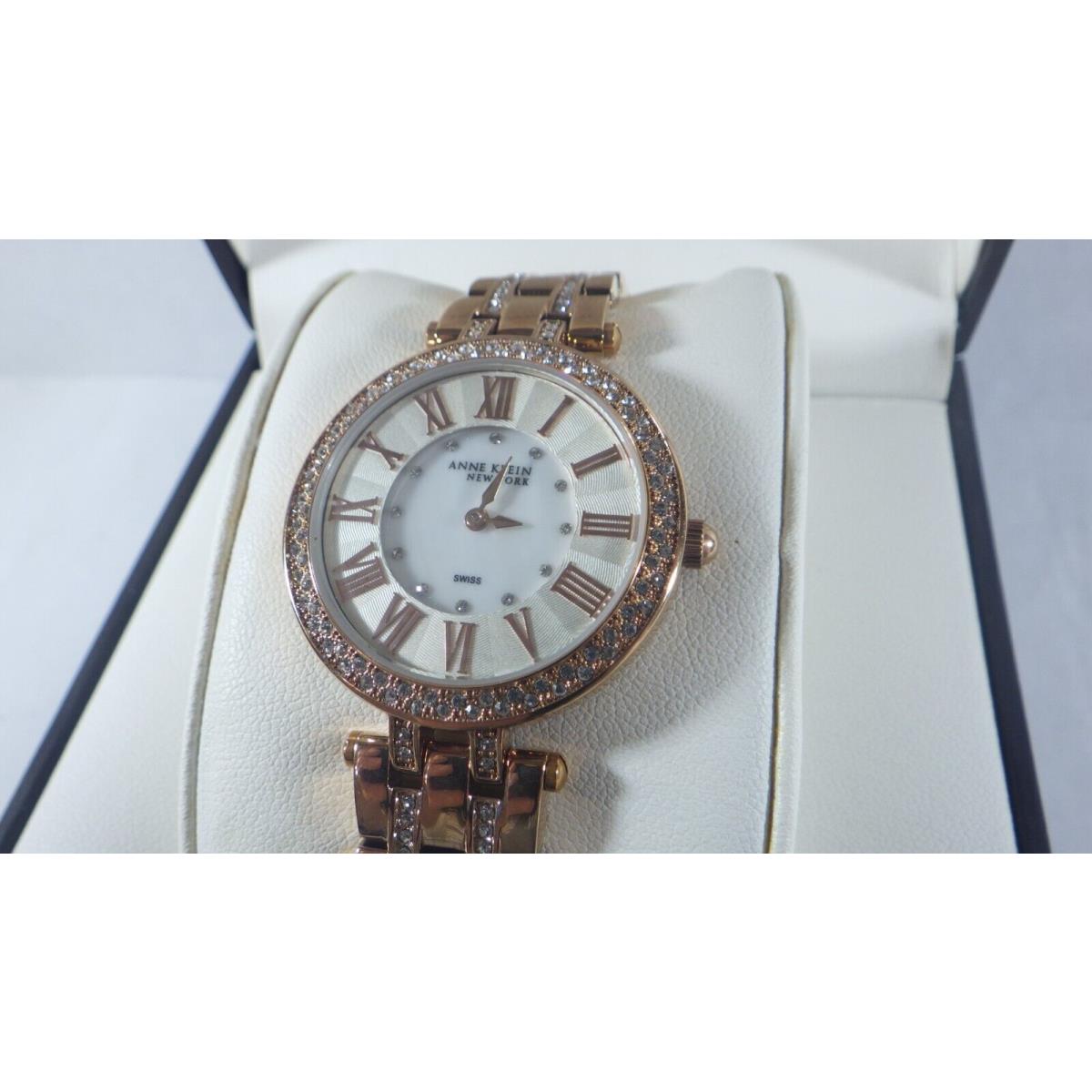 Anne Klein Women`s 12/2218WMRG Crystal Accented Rose Gold Tone Watch w/ Mop Dial