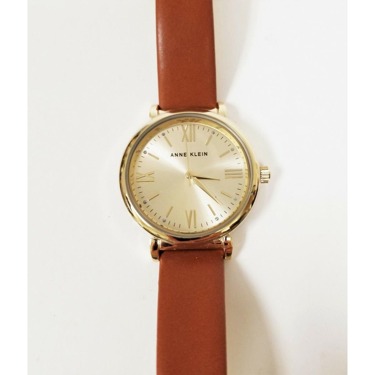 Anne Klein Gold Tone Brown Leather Backing Roman Numerals Watch AK/2954