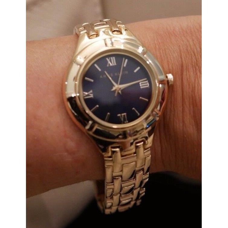 WT Box Women`s Anne Klein Yellow Gold Tone Dark Blue Face Watch Stainless