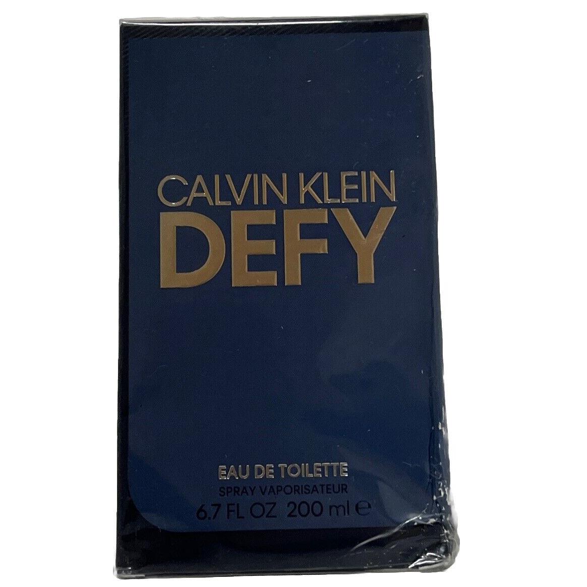 Defy by Calvin Klein 6.7 oz Edt Perfume For Men In Dented Box