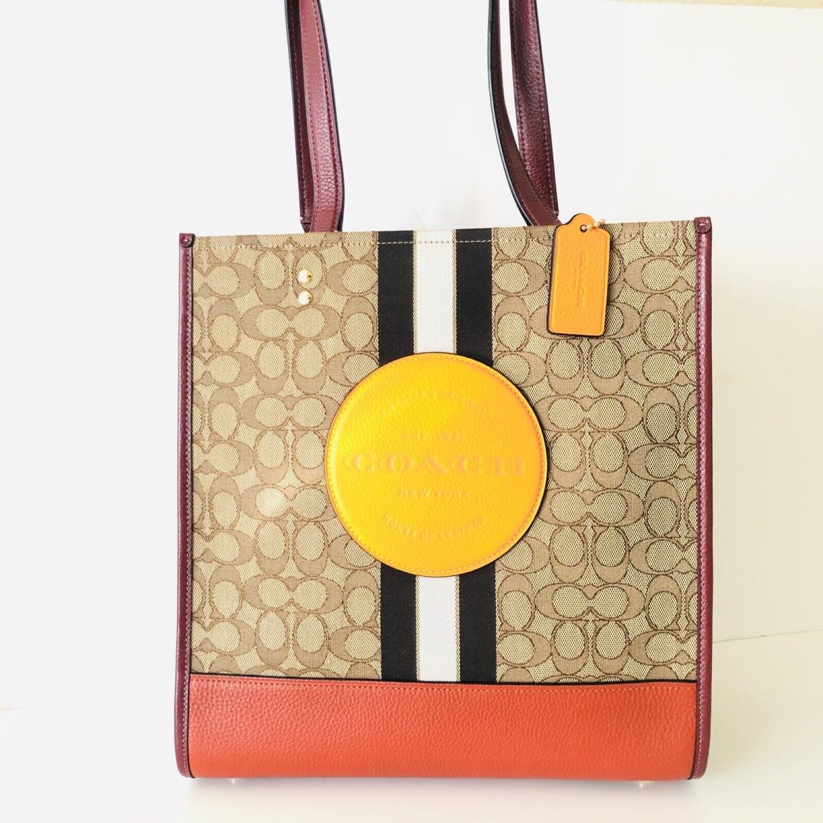 Coach Dempsey Tote Brown Signature Jacquard Orange Leather Patch Purse