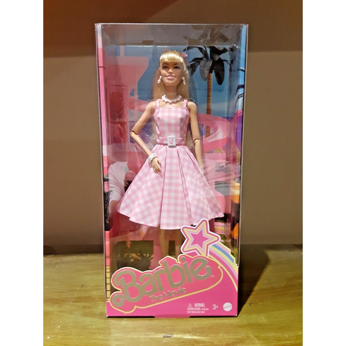 Barbie The Movie Doll Margot Robie Pink and Gingham Dress