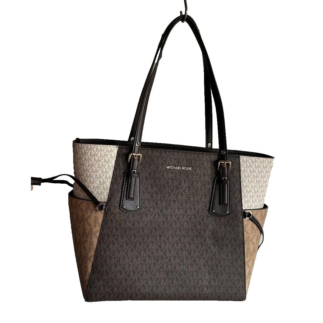 Michael Kors EW Signature Logo Voyager Tote Bag in Choc/multi - Handle/Strap: Brown, Hardware: Gold, Exterior: Multi