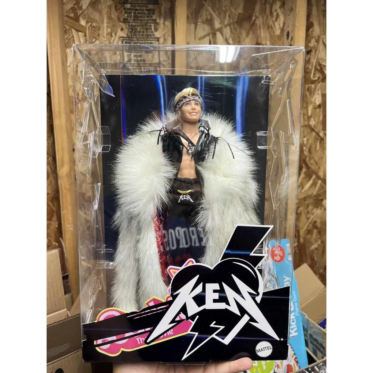 Barbie The Movie Ken Doll Wearing Fur Coat with Mattel Box IN Hand