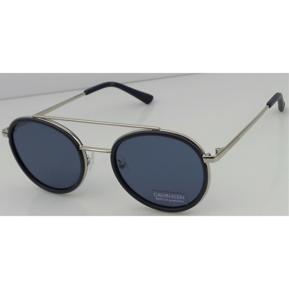 Calvin Klein CK19131S 410 Women`s Navy Frame Blue Lens Round Sunglasses