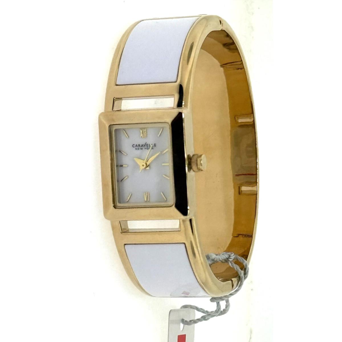 Caravelle New York 44L143 Women`s Round White/gold Tortoise Shell Bangle Watch