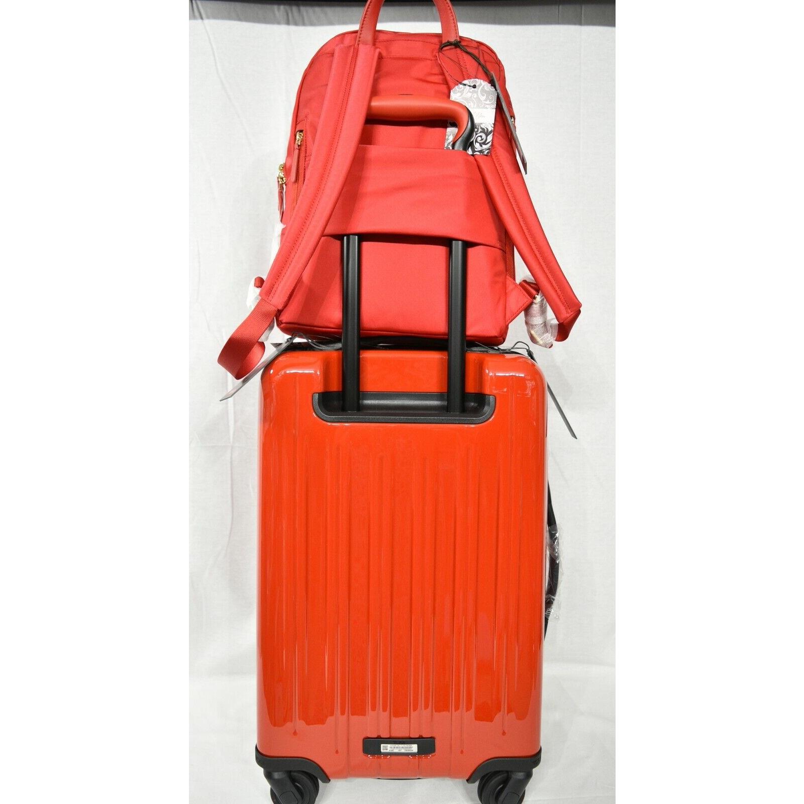 red tumi suitcase
